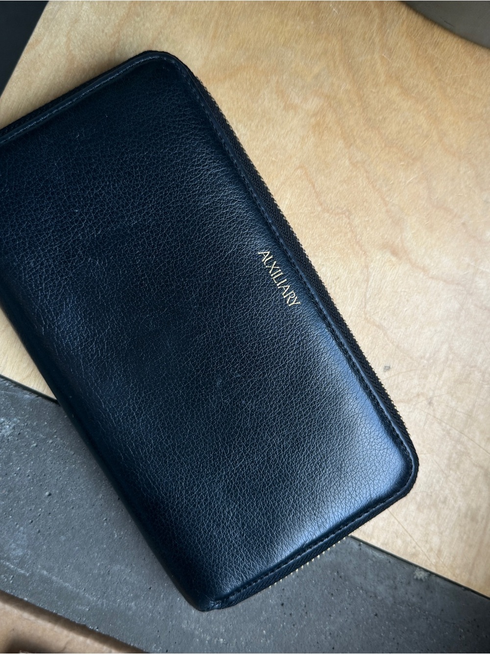 Auxiliary Black Leather Zip Wallet with Gold Logo